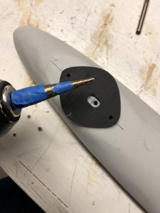 Double checking the holes aligned properly and then enlarging the hole for the wires to pass through