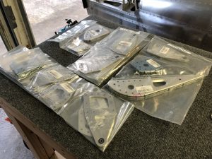 Bags of Flap assembly parts ready to be checked