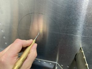 Using the center punch to mark the pilot holes